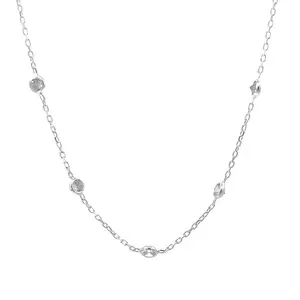 A Natkina Dolce Vita Necklace featuring a delicate white silver chain set with five bezel-set round diamond-imitation stones in a classic station layout.