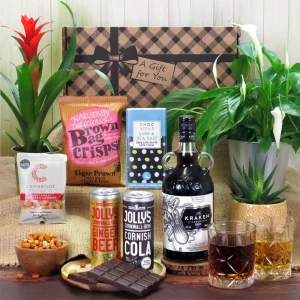 A premium Kraken spiced rum and savory snack gift hamper presentation.