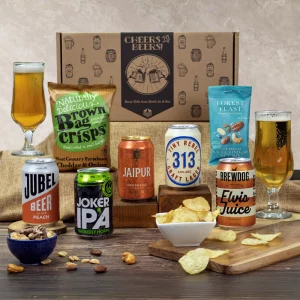 A premium craft beer selection and savory snack gift hamper presentation.