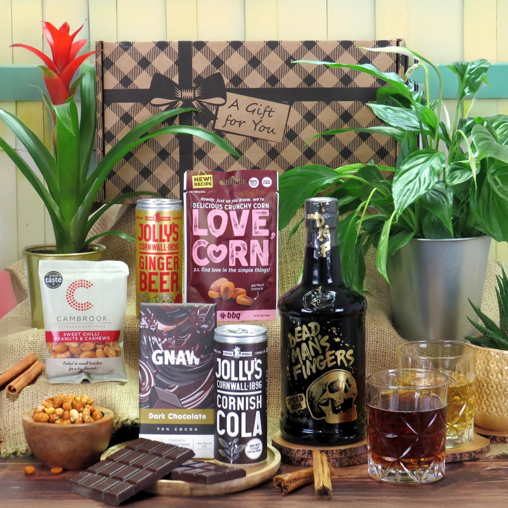 A premium Dead Man’s Fingers spiced rum and savory snack gift hamper presentation.