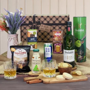 A premium Glenfiddich single malt whisky and Scottish snack gift hamper display.