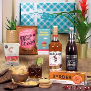 A premium Captain Morgan spiced rum and gourmet snack birthday hamper presentation.