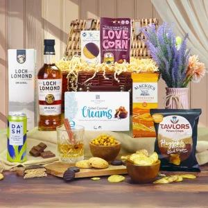 A premium Loch Lomond single malt whisky and Scottish snack wicker gift hamper presentation.