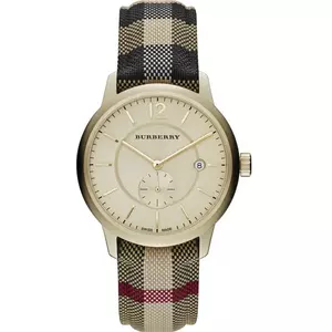 Burberry unisex Swiss-made quartz watch featuring a gold-tone dial and a signature house check fabric strap.