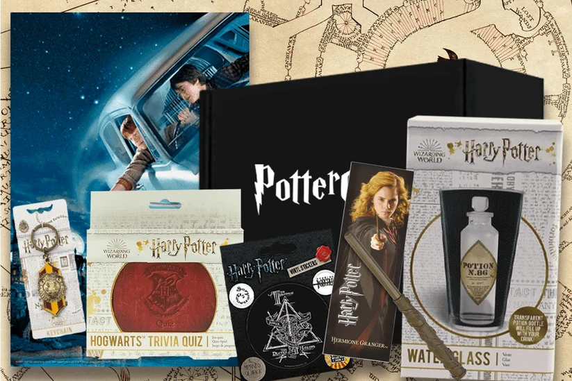 A collection of magical Wizarding World merchandise from a Harry Potter subscription box, featuring a trivia game, glassware, stickers, and character accessories.