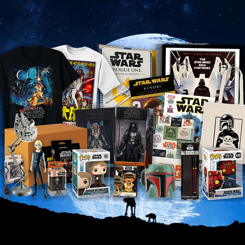 An ultimate collection of Star Wars gear and collectibles from a subscription box, featuring iconic characters from across the saga like Darth Vader, Boba Fett, and Anakin Skywalker.
