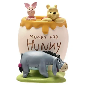 A Disney Winnie the Pooh ceramic piggy bank shaped like a honey pot.