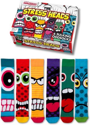 United Oddsocks "The Stress Heads" gift box featuring six mismatched socks with colorful, angry, and sulking monster cartoon faces.