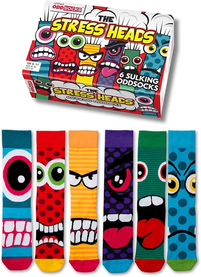 United Oddsocks "The Stress Heads" gift box featuring six mismatched socks with colorful, angry, and sulking monster cartoon faces.