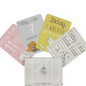 A box of Disney Baby Magical Beginnings Milestone Cards fanned out to display four cards featuring Marie, Dumbo, 101 Dalmatians, and Bambi themes.