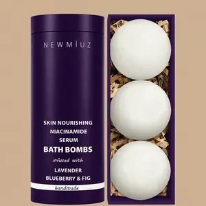 Packaging for NEW MIUZ Niacinamide Serum Bath Fizzers showing a purple branded tube next to a box containing three lavender, blueberry, and fig bath bombs.