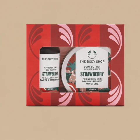 The Body Shop Strawberry Treats body care gift set, featuring a shower gel and a body butter tub inside a festive red box.