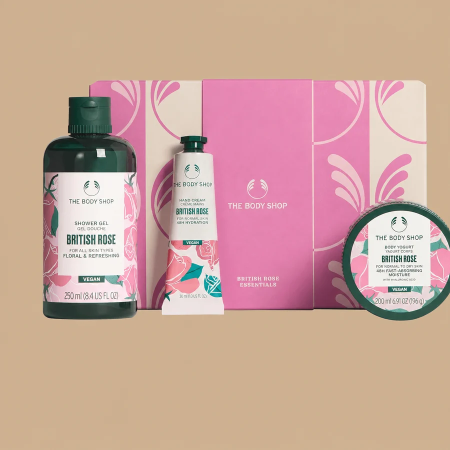 The Body Shop British Rose Essentials body care gift set, showcasing three individual rose-scented products arranged in front of a pink gift box.
