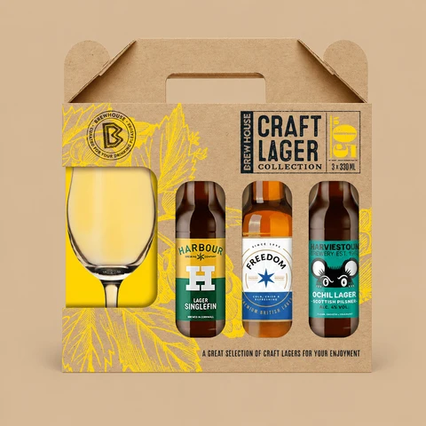 A Beerhunter Brew House Craft Lager Collection gift set in a cardboard carrying box featuring three craft beer bottles and a glass.
