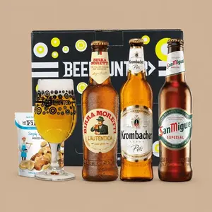 A Beerhunter Premium Lager Gift Pack featuring three distinct beer bottles, a branded glass filled with lager, and a snack pouch in front of a presentation box.