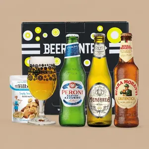 A Beerhunter Italian Lager Gift Pack featuring three distinct beer bottles, a branded glass filled with lager, and a snack pouch in front of a presentation box.