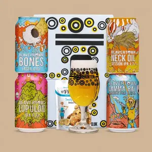 Beavertown Brewery craft beer gift pack featuring four distinct colorful cans, a branded beer glass filled with lager, and a small snack pouch.