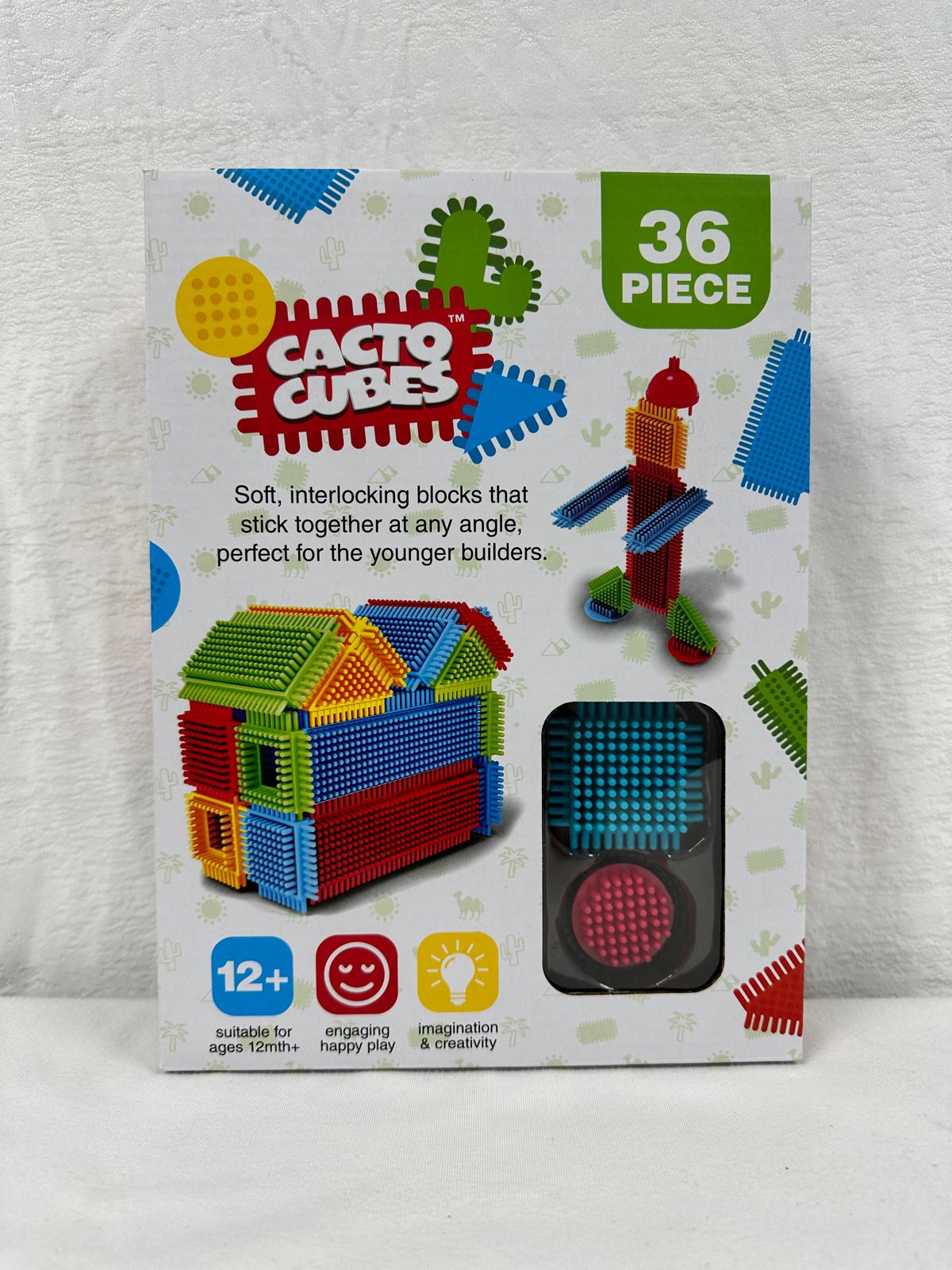 A boxed 36-piece Cacto Cubes construction toy set featuring soft, colorful interlocking bristle building blocks for children aged 12 months and older.