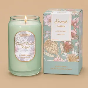 An "M&SENSE" Basil Wild Mint jar candle next to its floral product box.