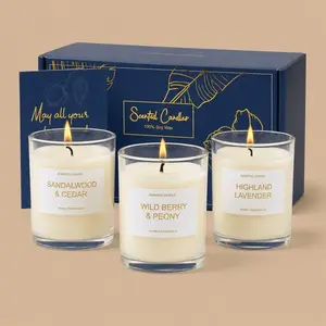 A three-pack soy wax glass jar candle gift set featuring lavender, berry, and sandalwood scents.