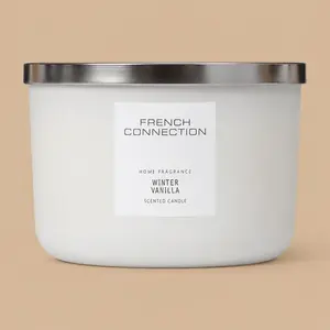 A closed French Connection Winter Vanilla jar candle with a silver lid.