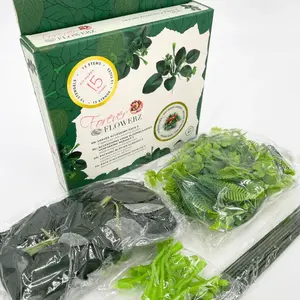 Packaging and unboxed components for the Forever Flowerz Leaves Accessory Pack 3, including artificial green leaves, dark foliage, and green wire flower stems.