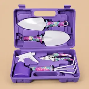 Open purple plastic carrying case containing a 5-piece gardening tool set with vibrant floral-patterned handles.