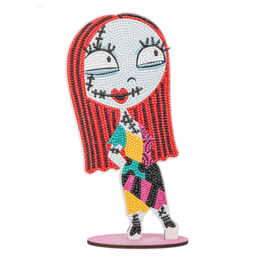 A completed 5D diamond painting Sally wooden figurine decorated with sparkling red, blue, yellow, and black resin crystal gems.