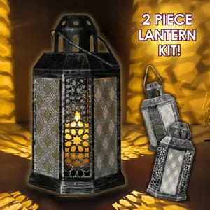 A completed 2-piece Crystal Art LED Candle Lantern craft kit decorated with shimmering silver and gold rhinestones to create a warm Moroccan twilight aesthetic.