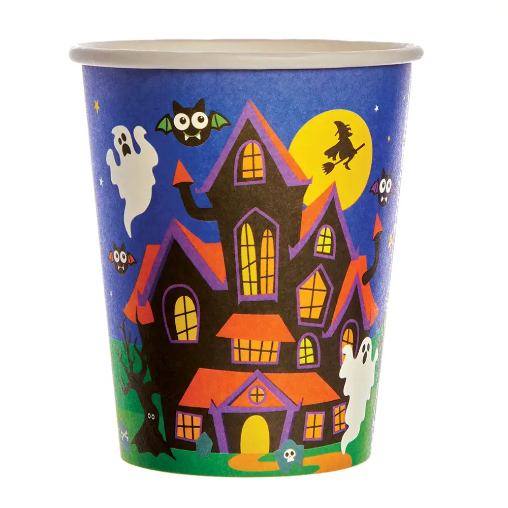 A dark blue disposable paper cup featuring a vibrant Halloween illustration of a spooky haunted house with orange roofs, surrounded by a full moon, a flying witch silhouette, a bat, and white cartoon ghosts.