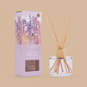 A Wax Lyrical "Sweet Dreams" reed diffuser shown alongside its matching purple, lavender-themed gift box.