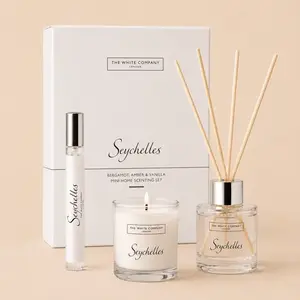 The White Company Seychelles home fragrance gift set with bergamot, amber, and vanilla scent notes, featuring a mini diffuser, candle, and home spray.