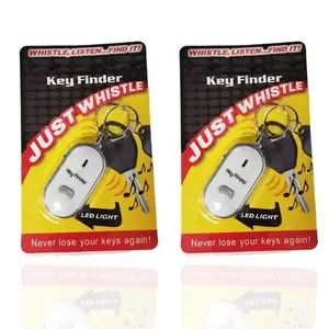 Two identical retail packs of a white, oval-shaped electronic whistle key finder with a built-in LED light.