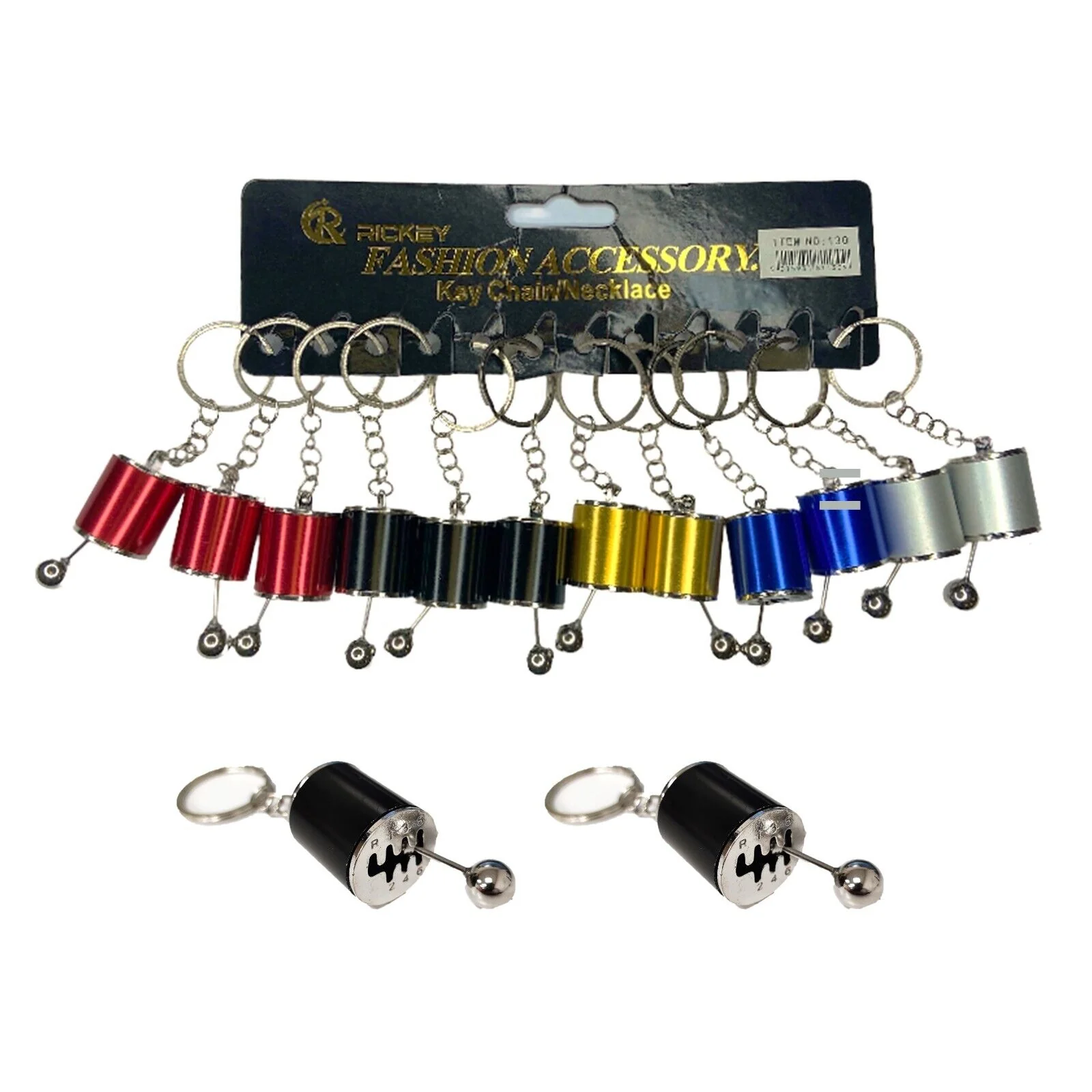 A multi-pack retail card of colorful 6-speed manual gear shifter keychains with two loose black variants displayed below.