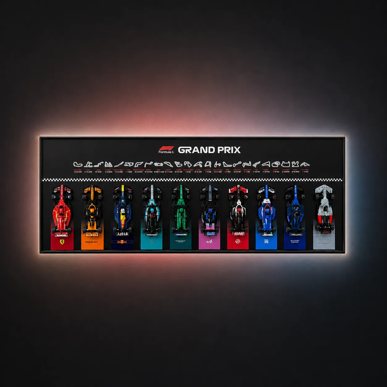 A horizontal, wall-mounted LEGO Speed Champions F1 Grand Prix display frame featuring ten brick-built race cars lined up beneath a row of minimalist circuit silhouettes and an ambient-lit orange background glow.