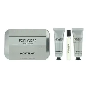 A Montblanc Explorer Platinum Discovery Kit showing a textured grey metal tin container next to three travel-sized grooming items standing upright.