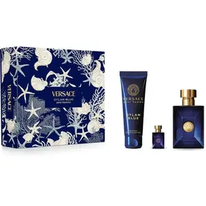 A Versace Dylan Blue Pour Homme men's fragrance gift set, featuring a blue and white decorative marine-themed box alongside a shower gel tube, a miniature bottle, and a full-sized dark blue cologne bottle.
