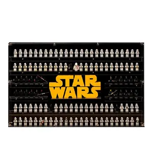 A wide, wall-mounted acrylic display case holding a massive collection of LEGO Star Wars minifigures neatly arranged on clear tiers around a large, central yellow Star Wars logo against a plain black background.