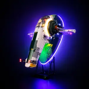 A completed LEGO Star Wars UCS Jango Fett's Firespray-Class Starship set fully illuminated with a custom LED light kit, casting vibrant blue and warm yellow light effects against a pitch-black background.