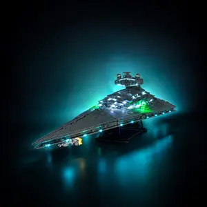 A completed LEGO Star Wars UCS Imperial Star Destroyer (75252) model fully illuminated with a custom LED light kit, showcasing glowing hull accent lights and green laser blasts against a dark background.