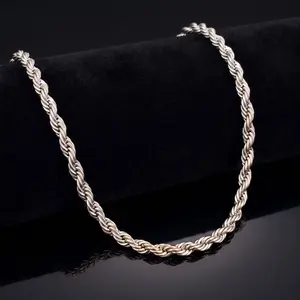 A classic silver rope chain necklace showcased on a black velvet display stand with a subtle reflection.