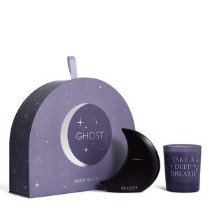 Ghost Deep Night fragrance gift set with a purple semi-circular moon presentation box, a black crescent moon-shaped perfume bottle, and a matching frosted lavender scented candle.
