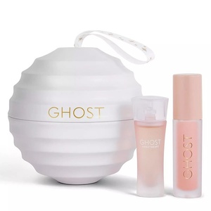 Ghost Sweetheart miniature gift set with a rippled white spherical tin ornament, a miniature frosted pink perfume bottle, and a soft peach lip oil tube.
