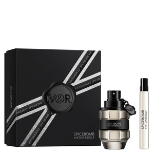 Viktor & Rolf Spicebomb fragrance gift set with a black box featuring silver typographic ribbon graphics, a grenade-shaped glass bottle, and a matching travel spray.