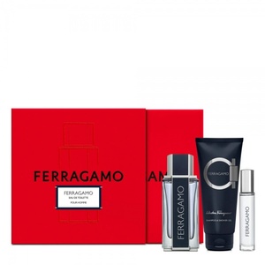 FERRAGAMO Pour Homme men's grooming gift set with a bright red debossed box, a clear glass cologne bottle, a matching navy blue tube of shampoo and shower gel, and a travel spray vial.
