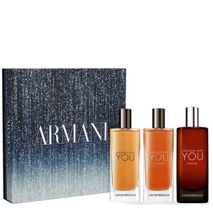 Emporio Armani Stronger With You fragrance trio discovery set featuring a shimmering blue and silver stardust box next to three travel-sized cologne bottles.